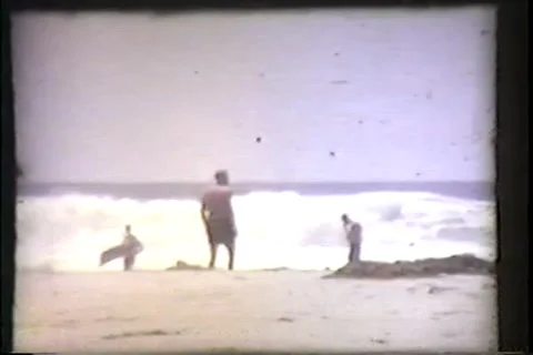 Single man on beach, waves, early 1960's Video stock 36080784