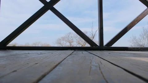 A single man on the bird watching tower and walking with naked foot Stock Footage 152914891