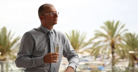 Single Man Celebrate Alone Drinking Champagne Palm Trees in Holidays Vacation Stock Footage 80306943