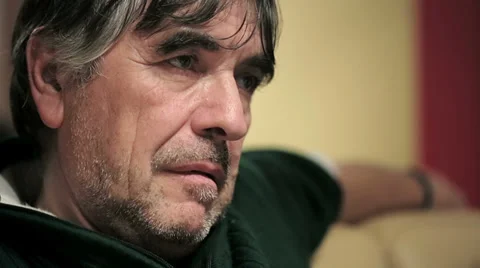 Single man on the couch watching tv Stock Footage 34281551