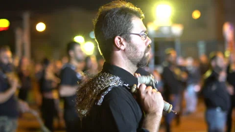 Single man with glasses beating himself during Muharram, Iran, 4K, DNxHR 스톡 동영상 150165137