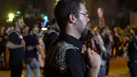 Single man with glasses beats himself during Muharram, Iran, 4K, DNxHR Stock-Footage 150165693