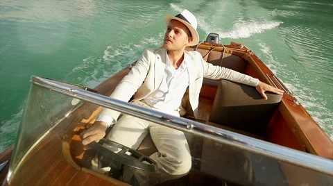 Single man riding in small boat over lake. carefree lifestyle background Video stock 42945497