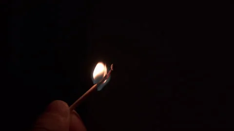 Single Match Flame Igniting in Dark Room Close Up Stock Footage 340912300