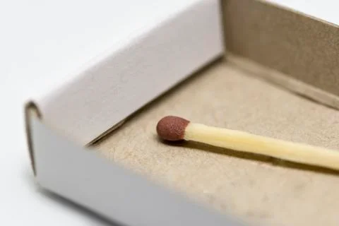 Single matchstick with a box Stock Photos