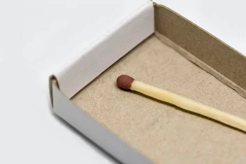 Single matchstick with a box Stock Photos