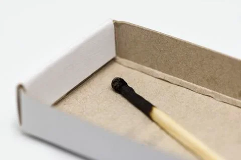 Single matchstick with a box Stock Photos