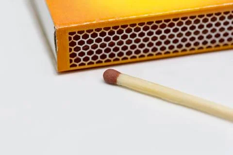 Single matchstick with a box Stock Photos