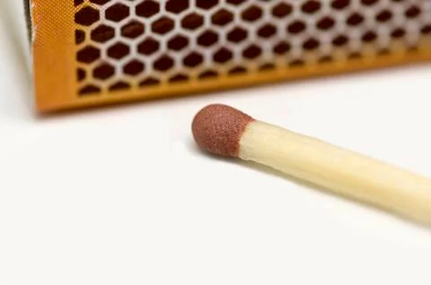 Single matchstick with a box Stock Photos