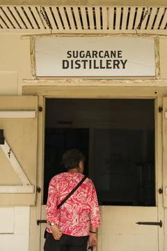 Single middle age looking inside the sugar cane rum distillery at the takam Stock Photos
