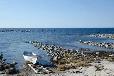 Single moored rowing boat Stock Photos