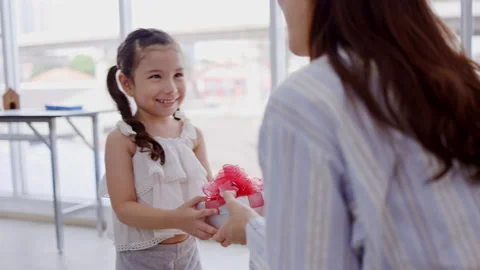 Single mother is dancing with her lovely daughter in her apartment happy. Stock Footage 181558089