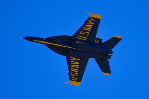 Single Navy Jet Flying In The Sky Stock Photos