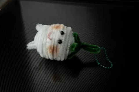 Single octopus crochet key, cute feather wire hanger, pipe cleaner craft ideas Stock Photos