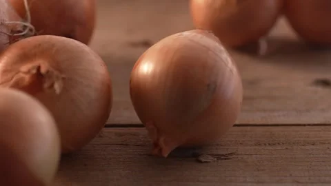 Single Onion Rolling Amongst Many. Stock Footage 260801738