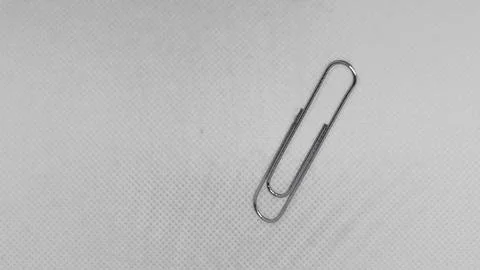 Single Paperclip on White Stock Photos