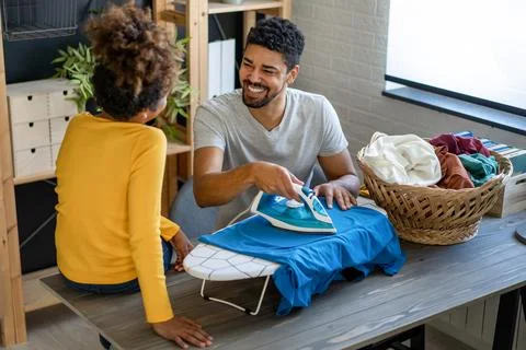 Single parent concept. Happy black father have fun with daughter while do d.. Fotos de archivo