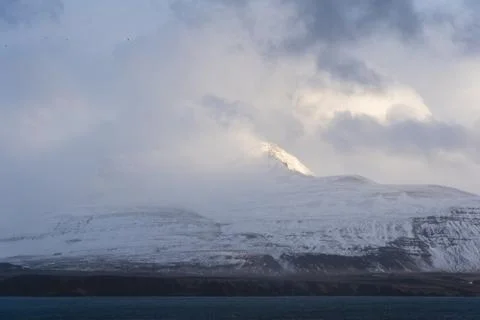 Single peak standing out from clouds 스톡 사진