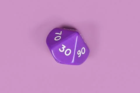 Single pentagonal D10 roleplaying RPG dice on violet background Stock Photos