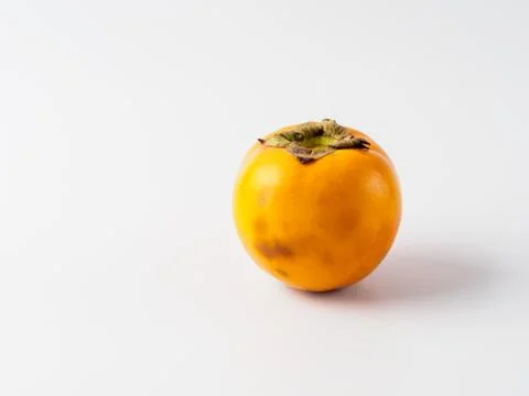 Single persimmon isolated on white background. Stock Photos