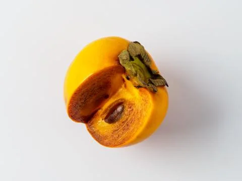 Single persimmon isolated on white background. Stock Photos