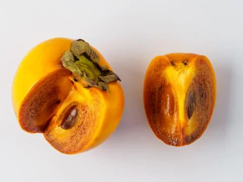 Single persimmon isolated on white background. Stock Photos