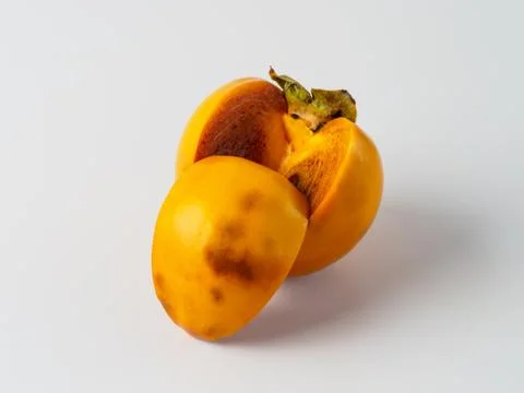 Single persimmon isolated on white background. Stock Photos