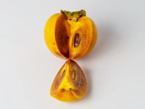 Single persimmon isolated on white background. Stock Photos