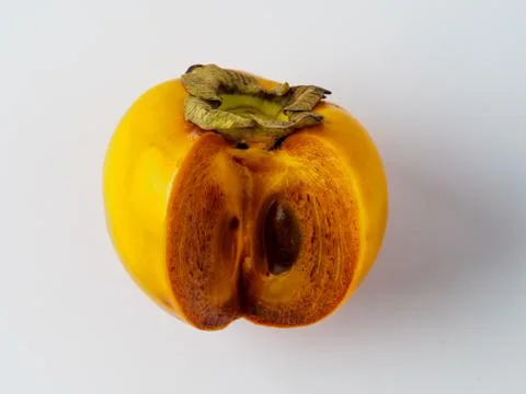 Single persimmon isolated on white background. Stock Photos