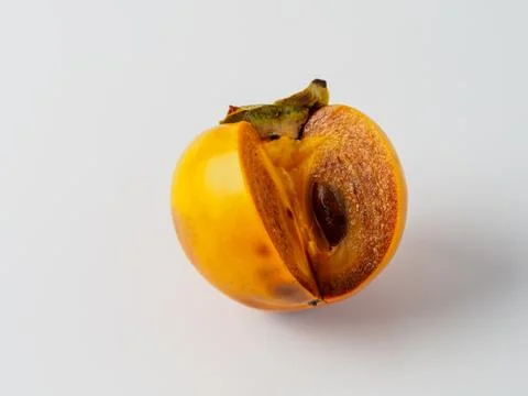 Single persimmon isolated on white background. Stock Photos