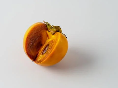 Single persimmon isolated on white background. Stock Photos