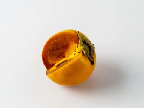 Single persimmon isolated on white background. Stock Photos