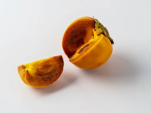 Single persimmon isolated on white background. Stock Photos