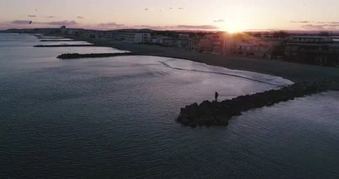Single person standing. Beatiful sunset at Palavas let Flotes Stock Footage 196321809