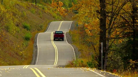 A single pick truck driving down a road Stock Footage 40466554