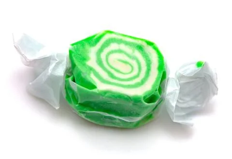 Single Piece of Green Salt Water Taffy on a White Background Stock Photos