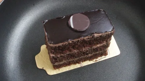 Single piece of a pastry cake rotating 스톡 동영상 161113444