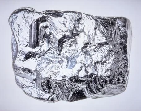 A single piece of raw silver ore with metallic luster and crystalline struc.. Stock Photos