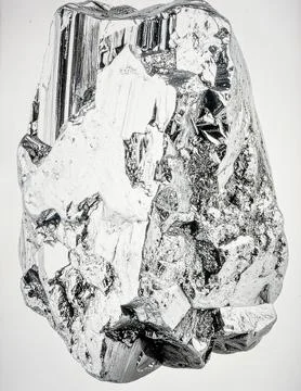 A single piece of raw silver ore with metallic luster and crystalline struc.. Stock Photos