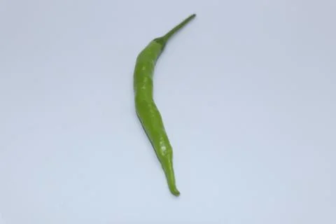 Single pieces of green chilli Stock Photos
