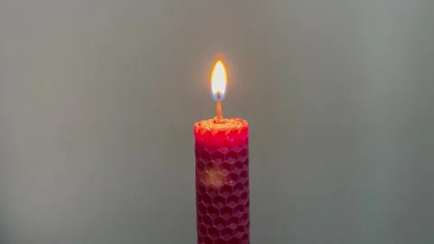 Single pink candle burning. Shot. Isolated on white background candle burning Stock-Footage 256880227