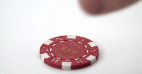 Single poker chip picked up Stock Footage 112329488
