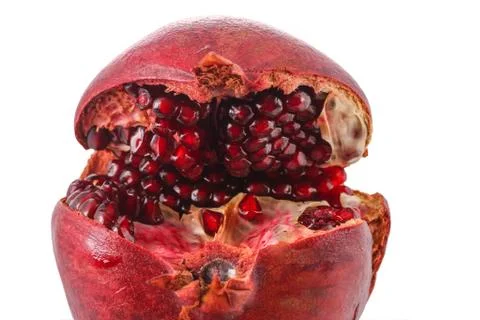 Single pomegranate on the white background Stock Photos