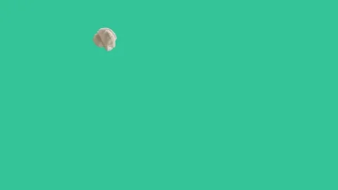 Single popcorn jumping and poping one by one in the air with cyan background Stock Footage 153244185