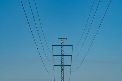 Single power line against a cloudless sky Stock Photos