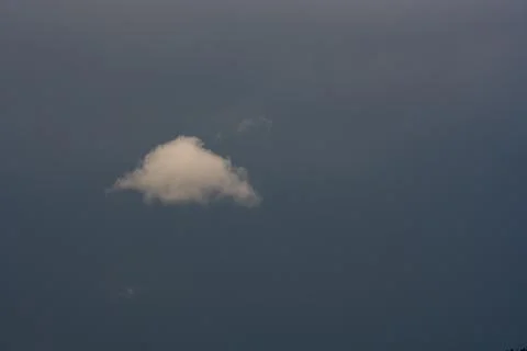 Single Puffy Cloud In Gray Sky Photos