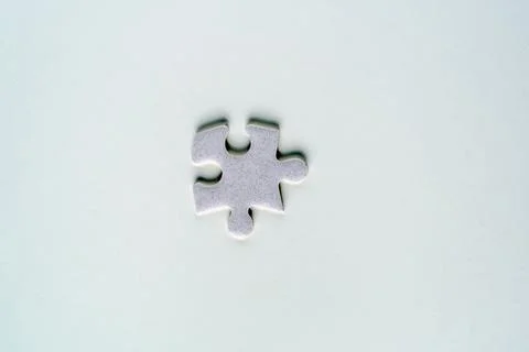 Single puzzle piece on textured background Stock Photos