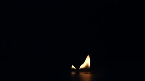 Single realistic fire flame burning, flickering, and gradually dying out. Видео 334020591