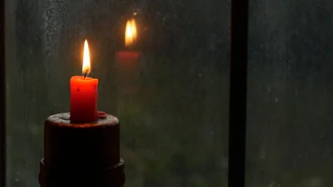 Single Red Candle Reflects Flickering in Window Pane Stock Footage 101400605