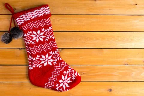 Single red color empty woollen Christmas stocking Stock Photos